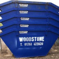 woodstone skip hire blue skips stacked up